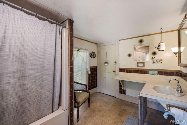 19 Reed St, Lockport City, NY 14094 - full bath featuring vanity, a wainscoted wall, shower / bath combo with shower curtain, and tile patterned floors