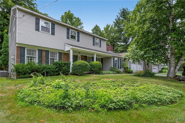 7569 Northfield Ln, Manlius, NY 13104 - view of front of house featuring a front yard, brick siding, and a chimney