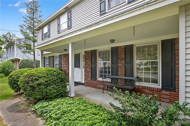 7569 Northfield Ln, Manlius, NY 13104 - property entrance with a porch and brick siding