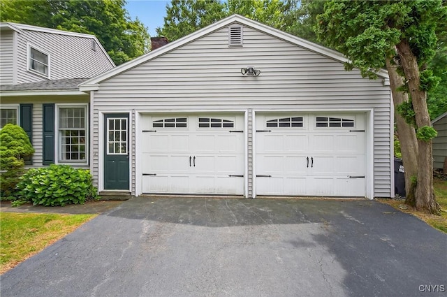 7569 Northfield Ln, Manlius, NY 13104 - garage with asphalt driveway