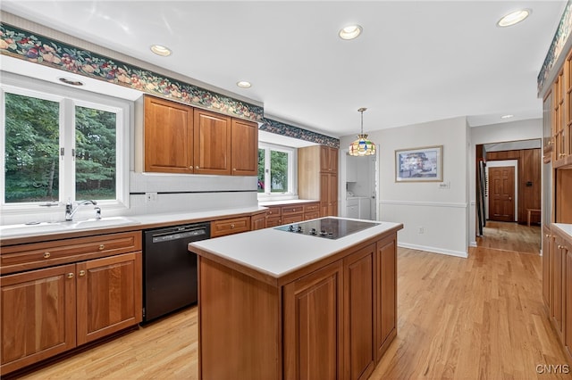 7569 Northfield Ln, Manlius, NY 13104 - kitchen featuring black appliances, brown cabinets, light wood-type flooring, and recessed lighting
