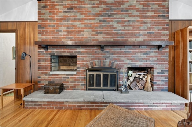 7569 Northfield Ln, Manlius, NY 13104 - detailed view of wood finished floors, a fireplace, and wooden walls