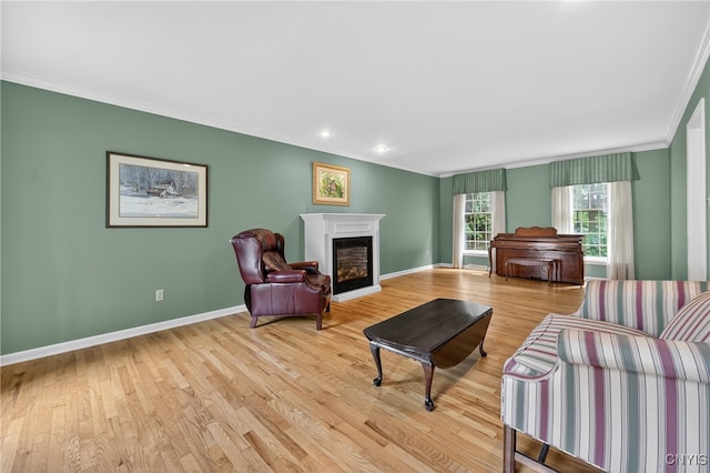 7569 Northfield Ln, Manlius, NY 13104 - living area featuring ornamental molding, light wood-style flooring, a glass covered fireplace, and recessed lighting