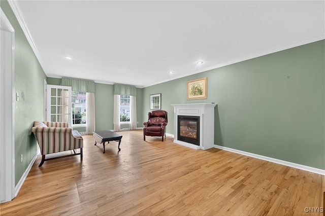 7569 Northfield Ln, Manlius, NY 13104 - living area with crown molding, light wood-style floors, a glass covered fireplace, and recessed lighting