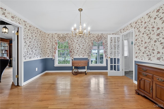 7569 Northfield Ln, Manlius, NY 13104 - unfurnished dining area featuring wallpapered walls, a chandelier, ornamental molding, and light wood-type flooring