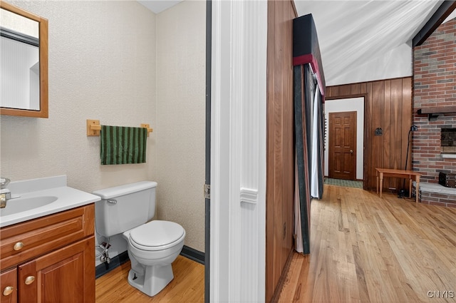 7569 Northfield Ln, Manlius, NY 13104 - bathroom featuring wood finished floors, vanity, and lofted ceiling