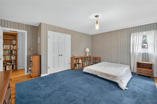 7569 Northfield Ln, Manlius, NY 13104 - bedroom featuring wallpapered walls, a closet, and carpet