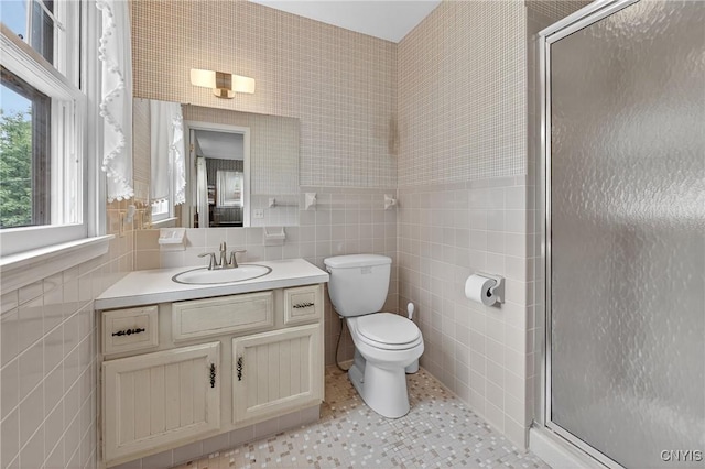 7569 Northfield Ln, Manlius, NY 13104 - bathroom with tile walls, vanity, a shower stall, and tile patterned flooring