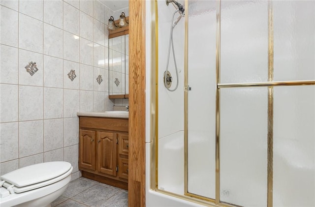 17 Francine Dr, Gates, NY 14606 - full bathroom with tile walls, vanity, an enclosed shower, and tile patterned floors