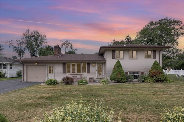 17 Francine Dr, Gates, NY 14606 - split level home featuring an attached garage, a chimney, and asphalt driveway