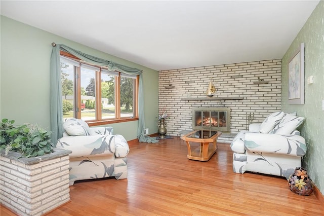 17 Francine Dr, Gates, NY 14606 - living area featuring wood finished floors and a brick fireplace