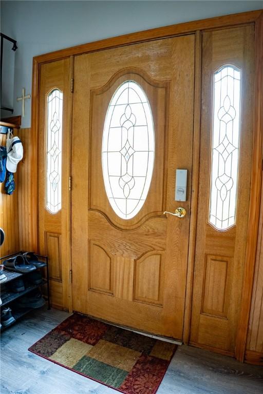 3 Willow Dr, Erwin, NY 14870 - foyer with healthy amount of natural light, wood finished floors, and wooden walls