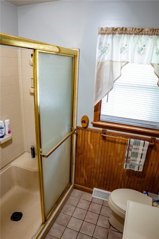3 Willow Dr, Erwin, NY 14870 - full bath with a stall shower, wainscoting, tile patterned flooring, and wood walls