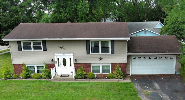 3 Willow Dr, Erwin, NY 14870 - bi-level home featuring asphalt driveway, a garage, a front yard, and brick siding