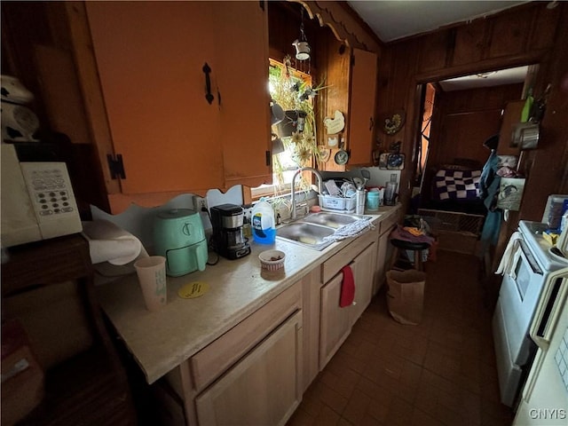 2369 State Route 5, Sullivan, NY 13037 - kitchen with stove, light countertops, wood walls, and brick patterned floors