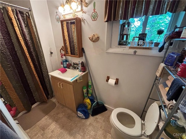 2369 State Route 5, Sullivan, NY 13037 - full bathroom with vanity, a shower with curtain, stone finish floors, and a chandelier