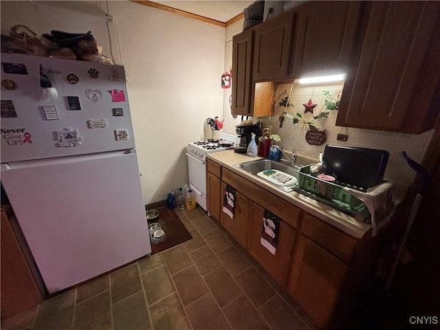 2369 State Route 5, Sullivan, NY 13037 - kitchen with white appliances, decorative backsplash, ornamental molding, and light countertops
