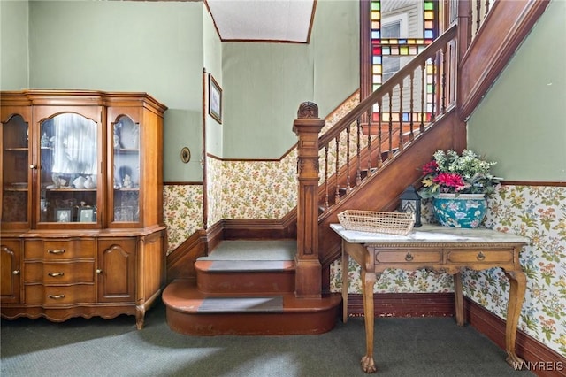 2469 Seneca St, West Seneca, NY 14210 - staircase with wallpapered walls, carpet, wainscoting, and a towering ceiling