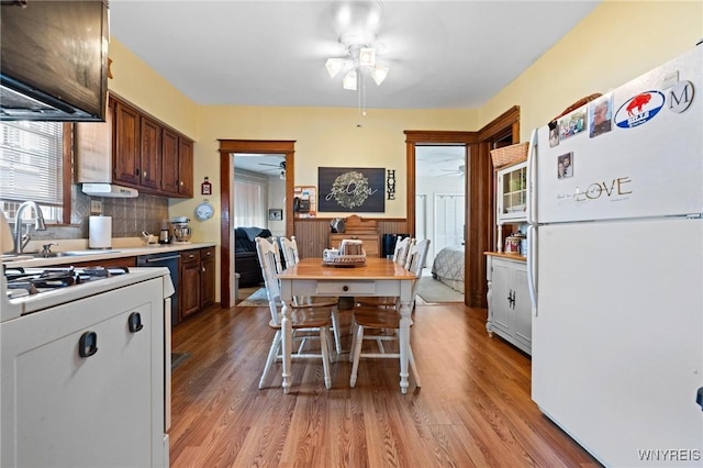 2469 Seneca St, West Seneca, NY 14210 - kitchen with freestanding refrigerator, ceiling fan, light wood-type flooring, and light countertops