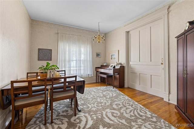 2469 Seneca St, West Seneca, NY 14210 - dining room featuring a chandelier and wood finished floors