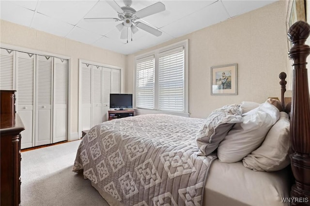 2469 Seneca St, West Seneca, NY 14210 - carpeted bedroom with multiple closets and a ceiling fan