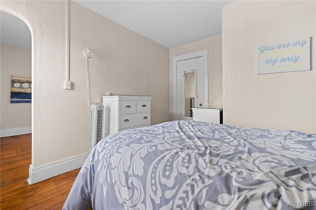 2469 Seneca St, West Seneca, NY 14210 - bedroom featuring wood finished floors and arched walkways