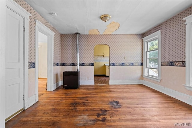 2469 Seneca St, West Seneca, NY 14210 - unfurnished room featuring wood finished floors, wallpapered walls, and a smoke detector