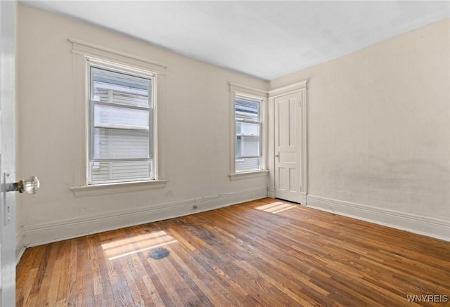 2469 Seneca St, West Seneca, NY 14210 - empty room with wood finished floors and baseboards