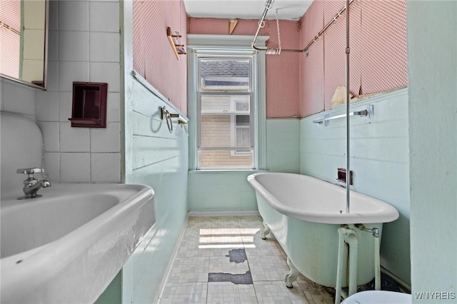2469 Seneca St, West Seneca, NY 14210 - bathroom with a freestanding bath, healthy amount of natural light, and tile patterned floors