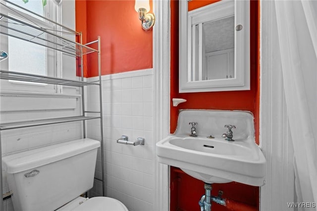 2469 Seneca St, West Seneca, NY 14210 - bathroom with tile walls and toilet