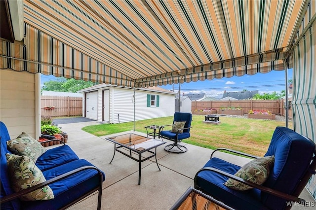 159 Beale Ave, Cheektowaga, NY 14225 - fenced backyard featuring an outdoor structure, a patio area, outdoor lounge area, and a detached garage