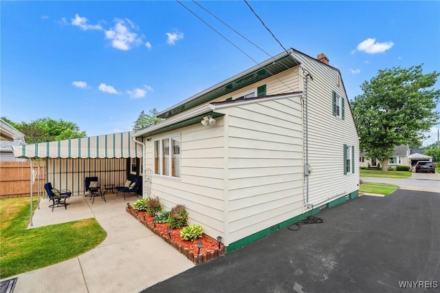 159 Beale Ave, Cheektowaga, NY 14225 - view of side of property with a patio area and a chimney