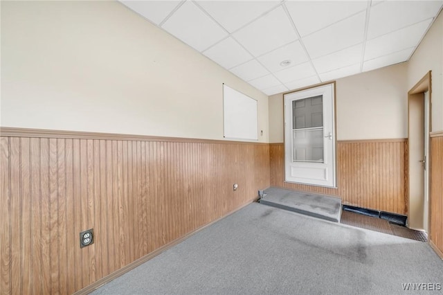 159 Beale Ave, Cheektowaga, NY 14225 - carpeted spare room featuring a wainscoted wall, a paneled ceiling, and wooden walls
