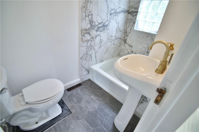 360 Ellison St, Rochester, NY 14609 - bathroom with tile patterned floors and a tub to relax in