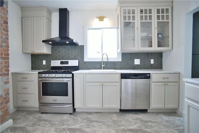360 Ellison St, Rochester, NY 14609 - kitchen featuring stainless steel appliances, wall chimney range hood, light countertops, and tasteful backsplash