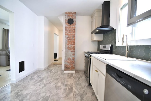 360 Ellison St, Rochester, NY 14609 - kitchen featuring wall chimney exhaust hood, stainless steel appliances, decorative backsplash, light countertops, and white cabinets