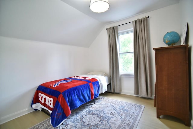 360 Ellison St, Rochester, NY 14609 - bedroom featuring lofted ceiling and wood finished floors