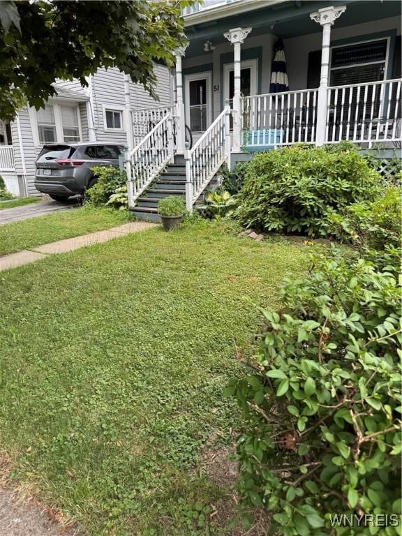 51 Ashton Pl, Buffalo, NY 14220 - view of grassy yard featuring a porch