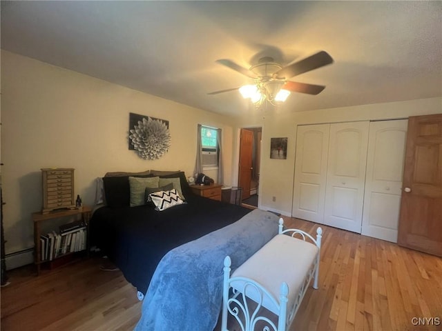 20 Pond Path, Oswego, NY 13126 - bedroom featuring light wood-style flooring, baseboard heating, a closet, and ceiling fan