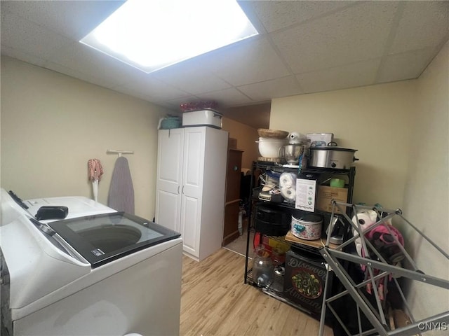 20 Pond Path, Oswego, NY 13126 - laundry room with independent washer and dryer, cabinet space, and light wood-style flooring