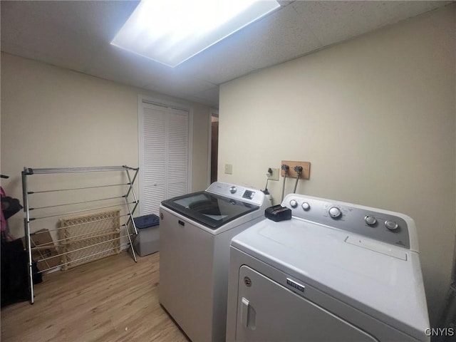 20 Pond Path, Oswego, NY 13126 - washroom featuring washing machine and clothes dryer and light wood-style floors