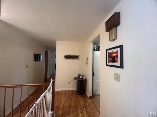 20 Pond Path, Oswego, NY 13126 - hall featuring light wood-type flooring and an upstairs landing