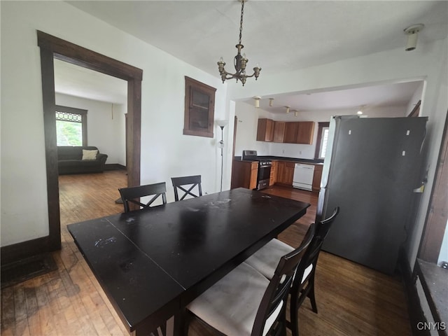 826 Lancaster Ave, Syracuse, NY 13210 - dining space featuring dark wood-style floors and a chandelier