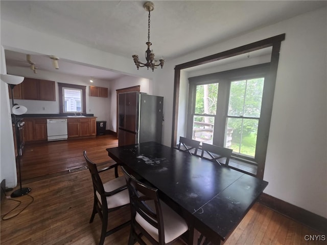 826 Lancaster Ave, Syracuse, NY 13210 - dining room with a chandelier and dark wood-type flooring
