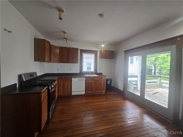 826 Lancaster Ave, Syracuse, NY 13210 - kitchen featuring white dishwasher, stainless steel range with gas stovetop, dark wood-style floors, dark countertops, and brown cabinets