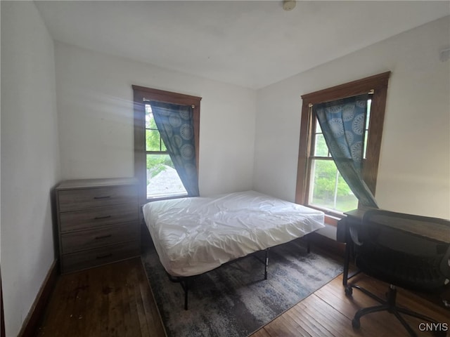 826 Lancaster Ave, Syracuse, NY 13210 - bedroom featuring hardwood / wood-style flooring and multiple windows