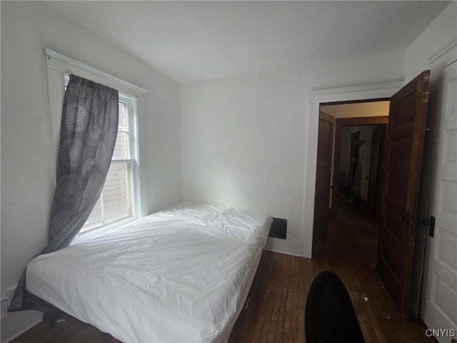 826 Lancaster Ave, Syracuse, NY 13210 - bedroom featuring dark wood-style flooring and baseboards