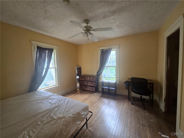 826 Lancaster Ave, Syracuse, NY 13210 - bedroom with hardwood / wood-style floors, a textured ceiling, and ceiling fan