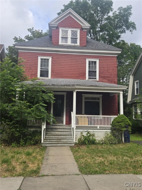 826 Lancaster Ave, Syracuse, NY 13210 - american foursquare style home featuring covered porch and a shingled roof