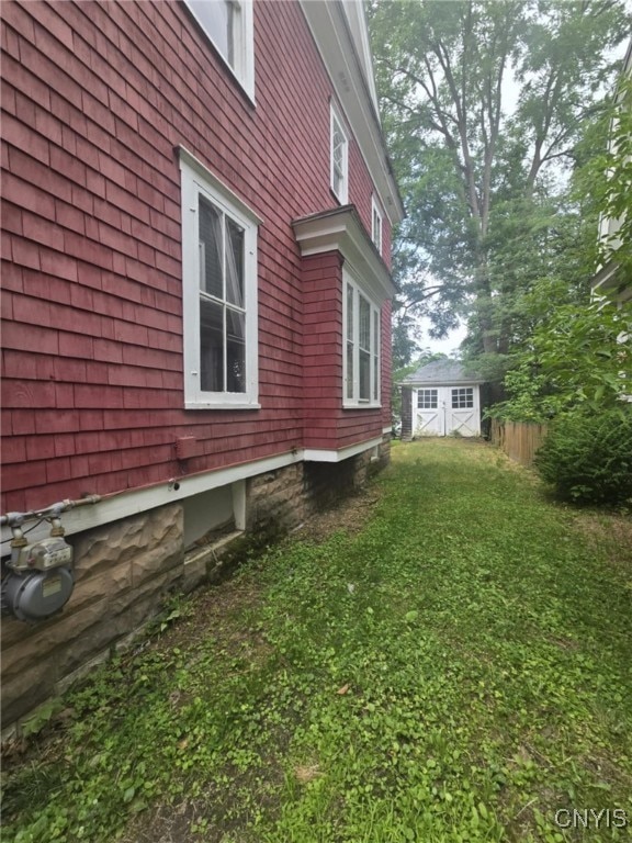 826 Lancaster Ave, Syracuse, NY 13210 - view of property exterior featuring an outdoor structure and a lawn